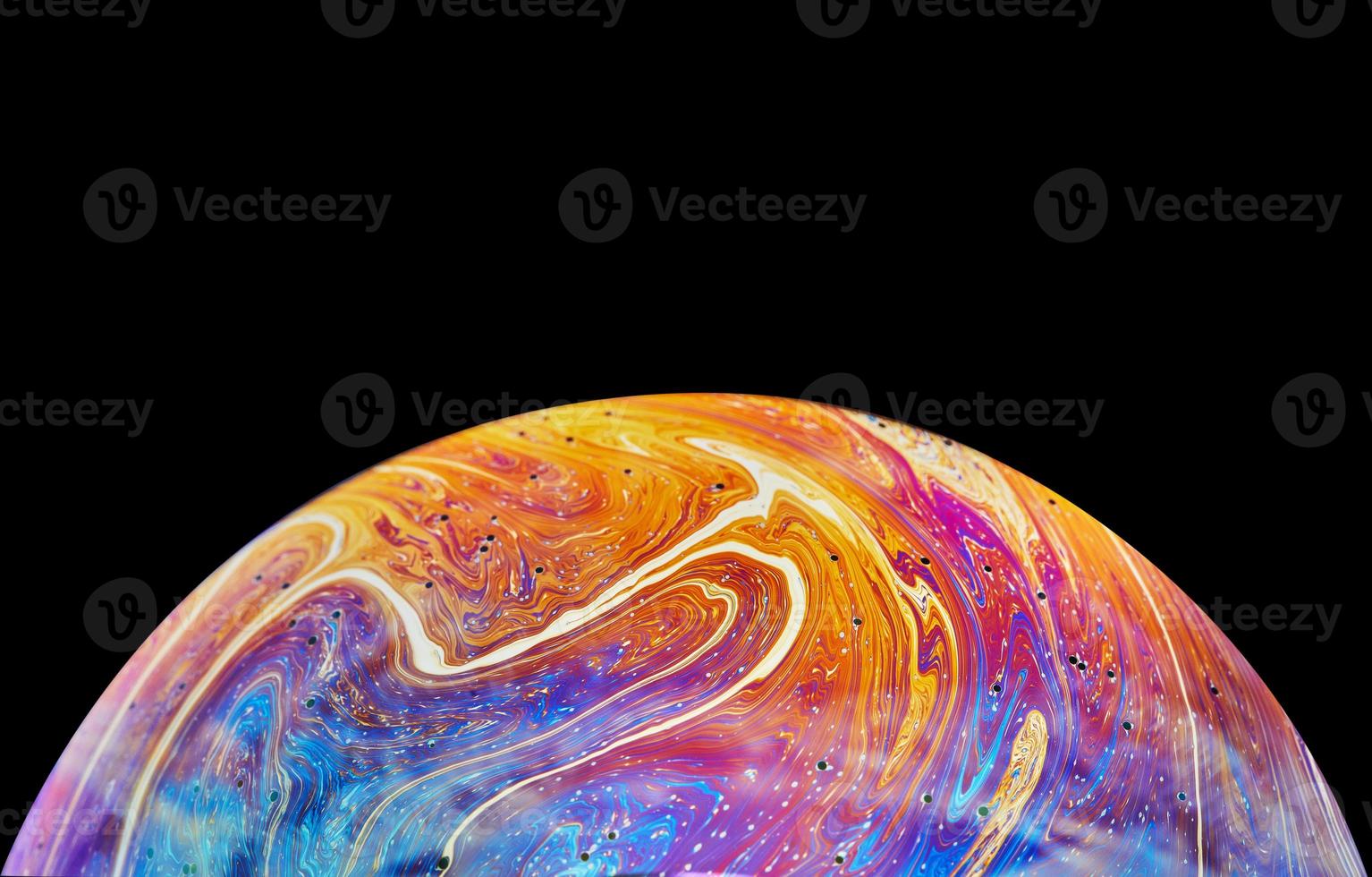 Virtual reality space with abstract multicolor psychedelic planet. Closeup Soap bubble like an alien planet on black background photo