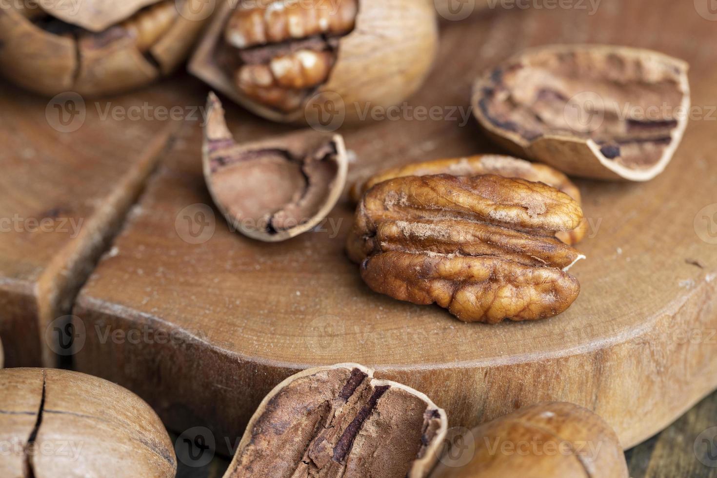Pecan in a shell on the table photo