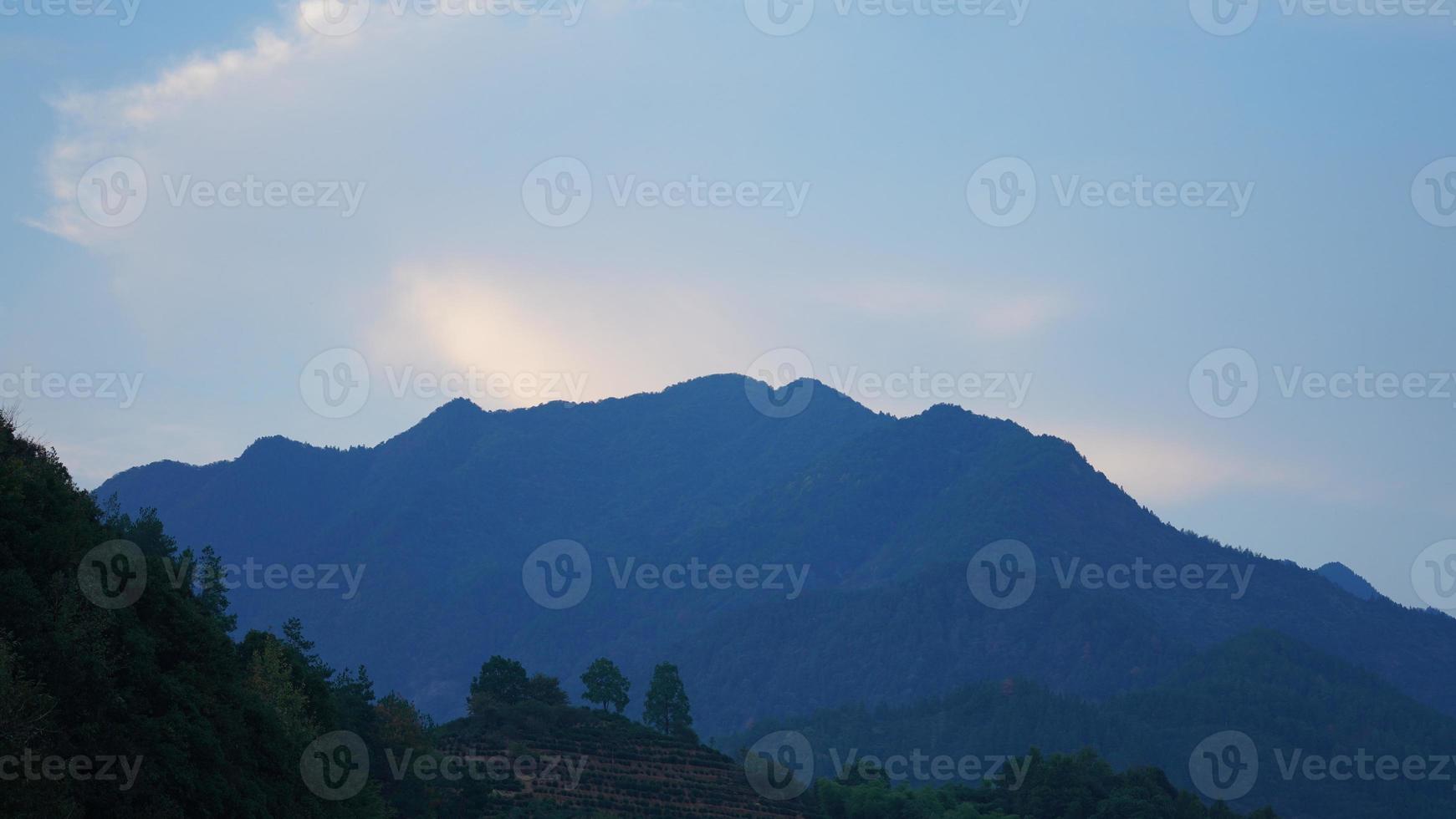 The beautiful countryside view with the mountains and forest as background photo