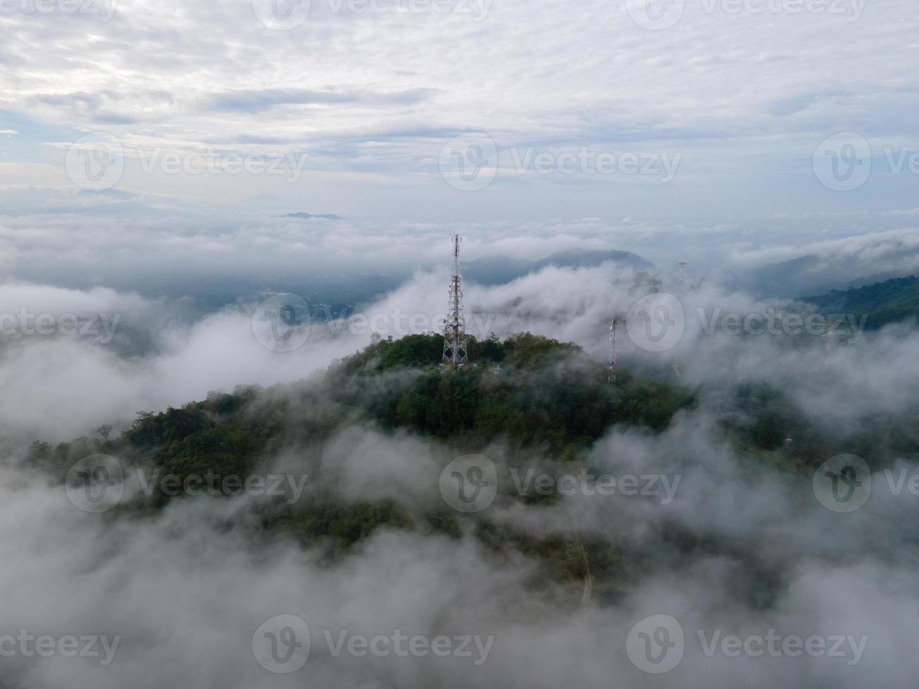 Aerial view 4G, 5G telecom tower in misty morning photo