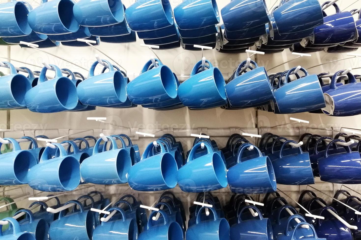 colorful cup store. cups of different colors standing In shop photo