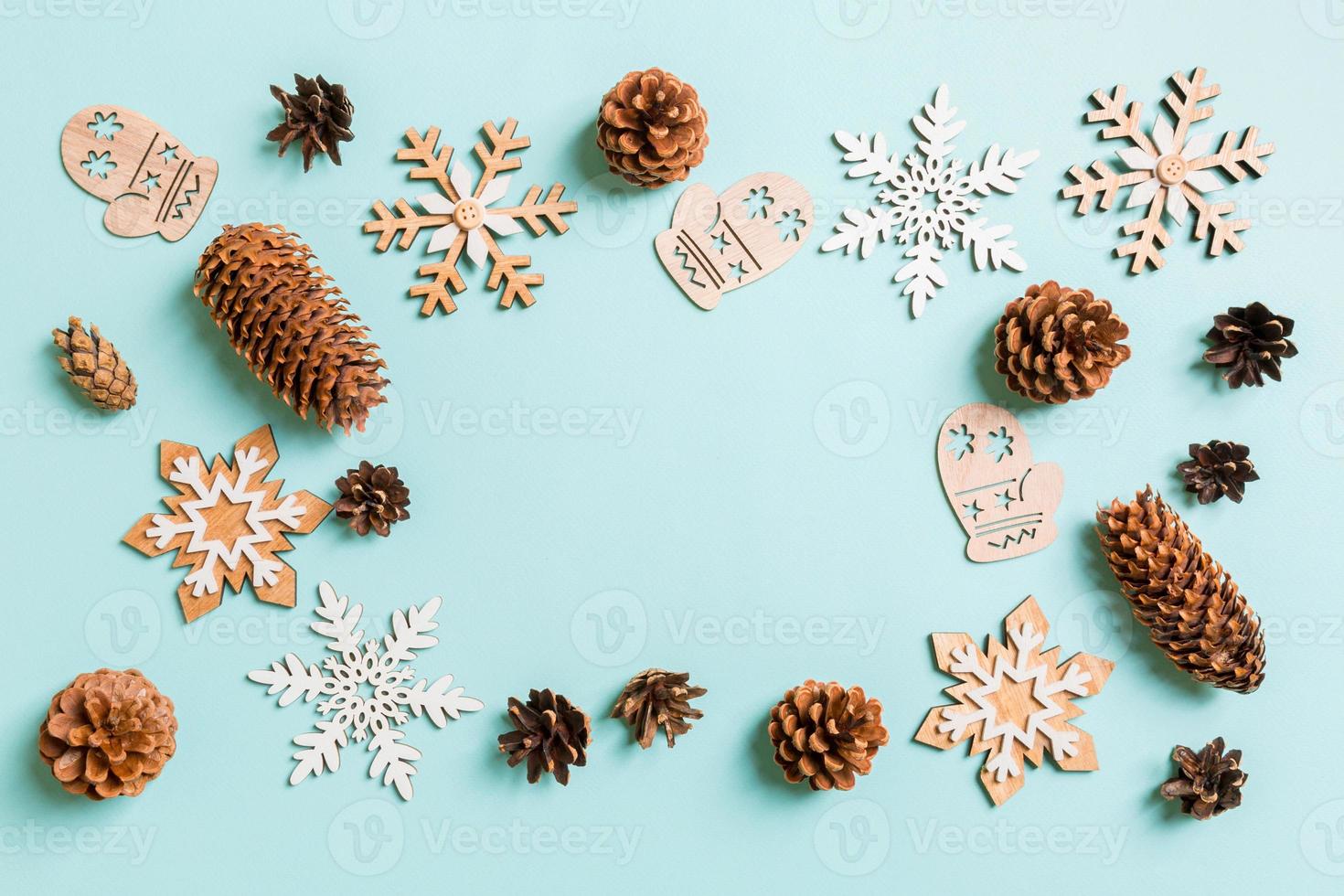 Top view of holiday toys and decorations on blue Christmas background. New Year time concept with copy space photo