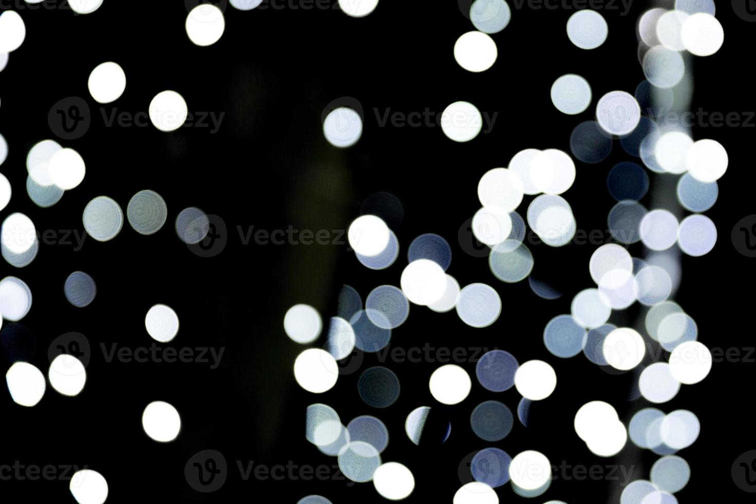 Abstract blur black and white bokeh background. many round light on background photo