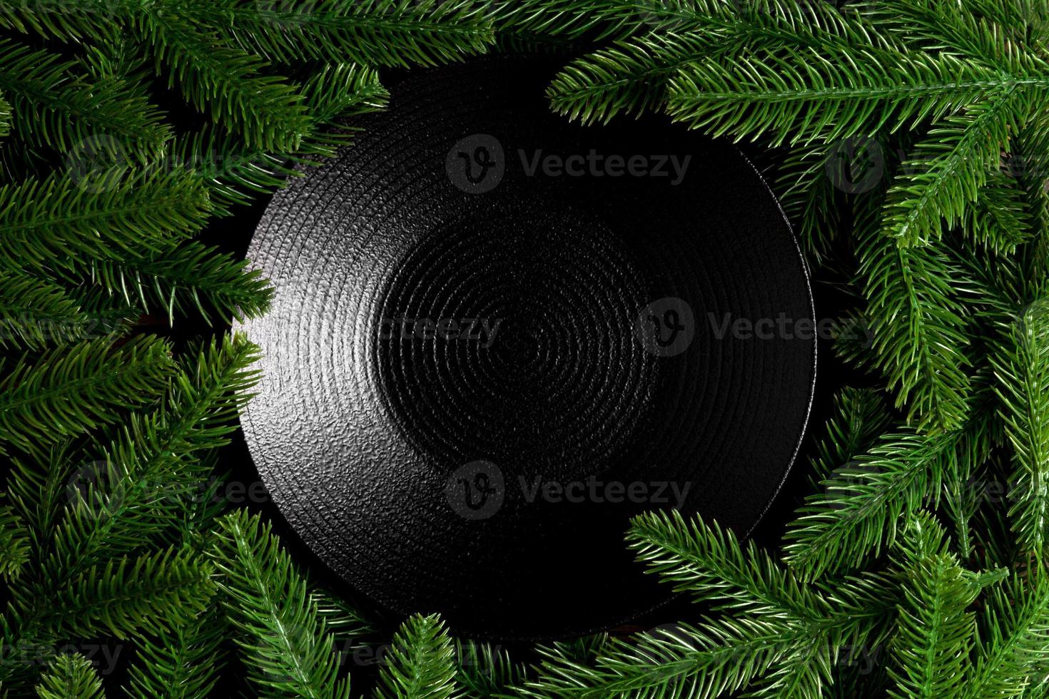 Top view served plate with green fir tree branches. Holiday dinner concept with copy space photo