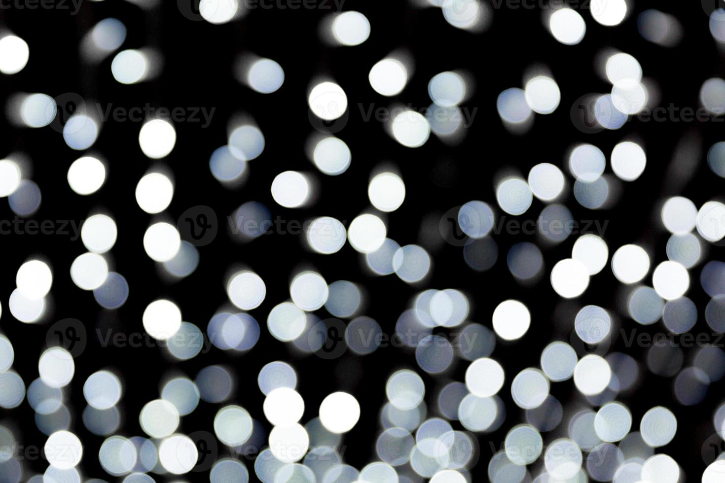 Abstract blur black and white bokeh background. many round light on background photo