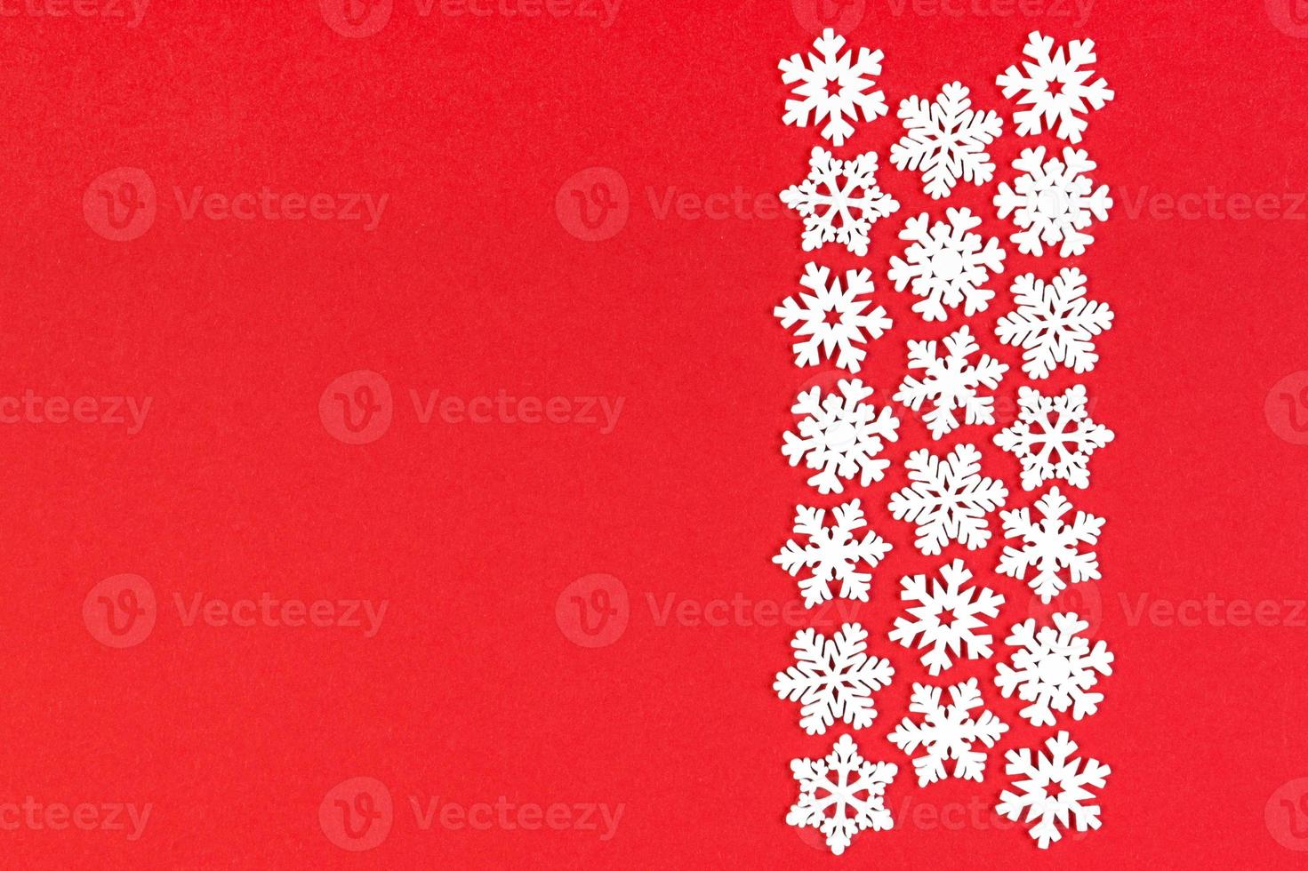 Top view of winter ornament made of white snowflakes on colorful background. Happy New Year concept with copy space photo