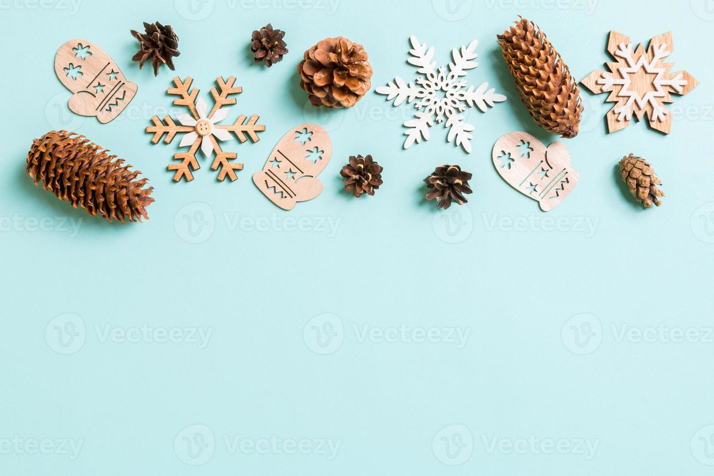 Top view of holiday toys and decorations on blue Christmas background. New Year time concept with copy space photo