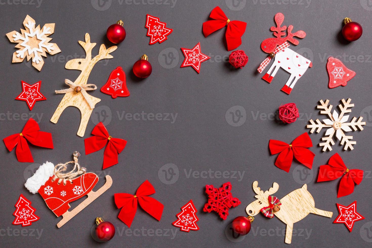 Christmas black background with holiday toys and decorations. Happy New Year concept with empty space for your design photo