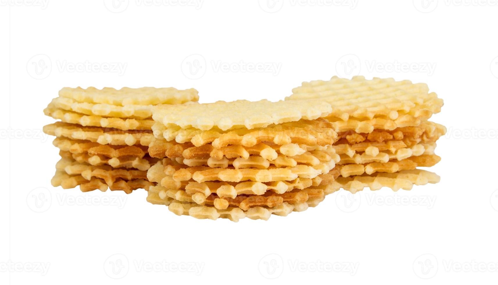 A stack of golden round waffles isolated. photo