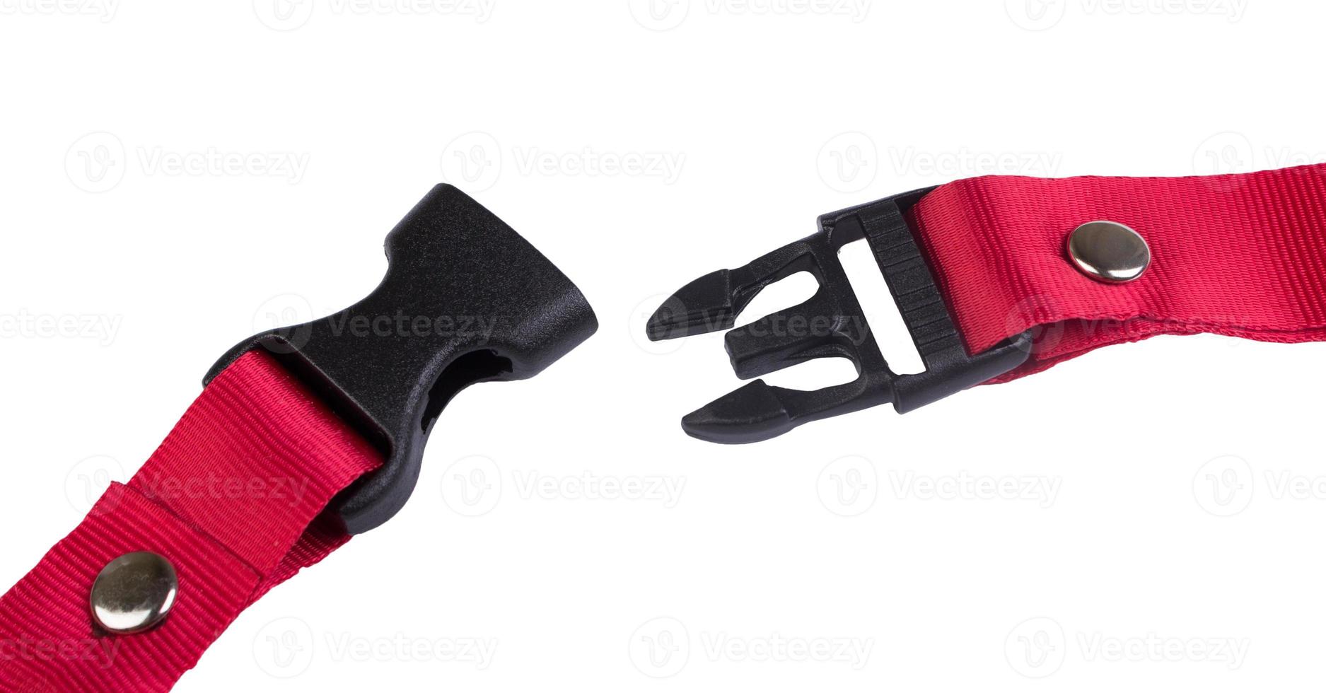 Open black plastic side release buckle with red woven strap attached photo