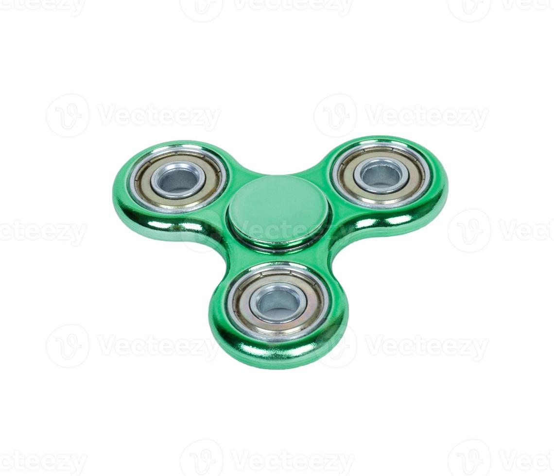 fidget spinner green isolated on white background photo