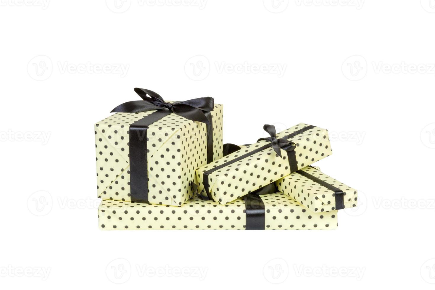 Set of Christmas or other holiday handmade present in yellow paper with black ribbon. Isolated on white background, top view. thanksgiving Gift box concept photo