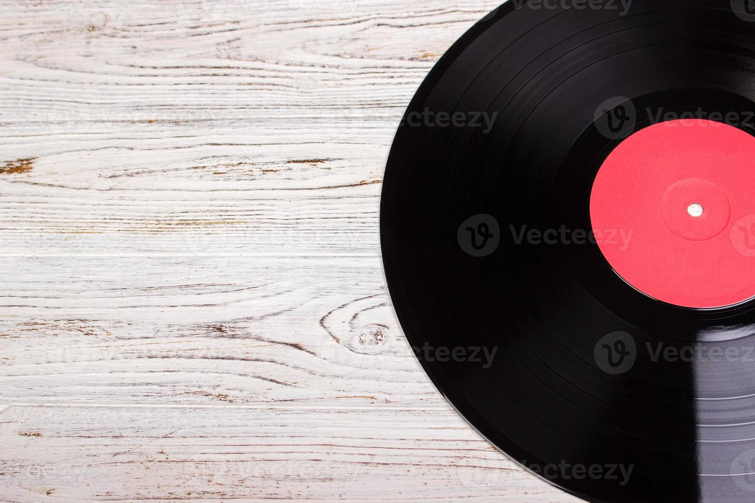 vinyl record in wood background, vinyl disc photo