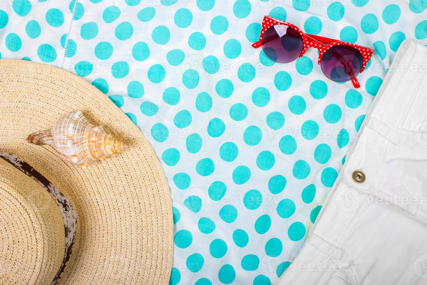Straw Beach Woman's Hat Sun Glasses Top View Seashell Shorts with space for text. photo