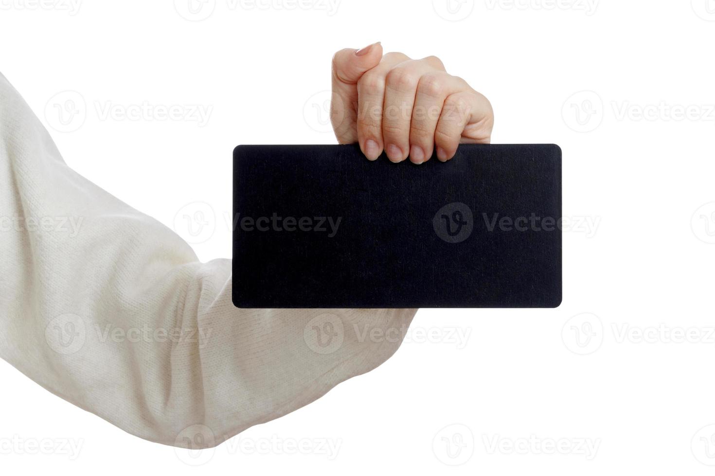 Girl holding an small blackboard isolated on white background photo