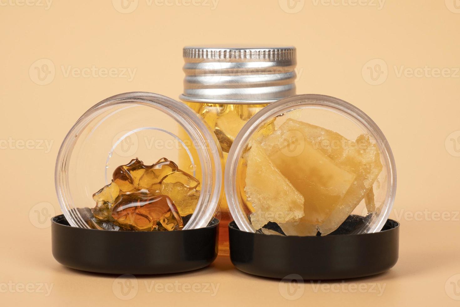 bottles with different varieties of cannabis golden  wax extract photo