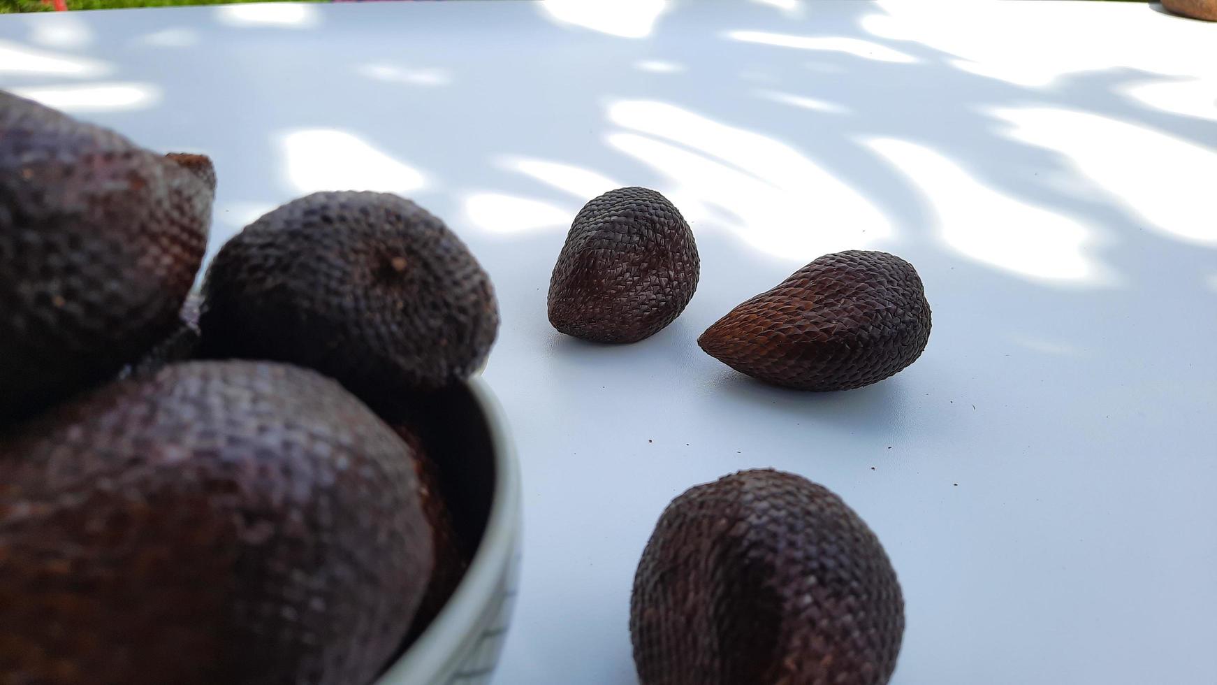 Salak fruit in a bowl on a white background, Close up 01 photo