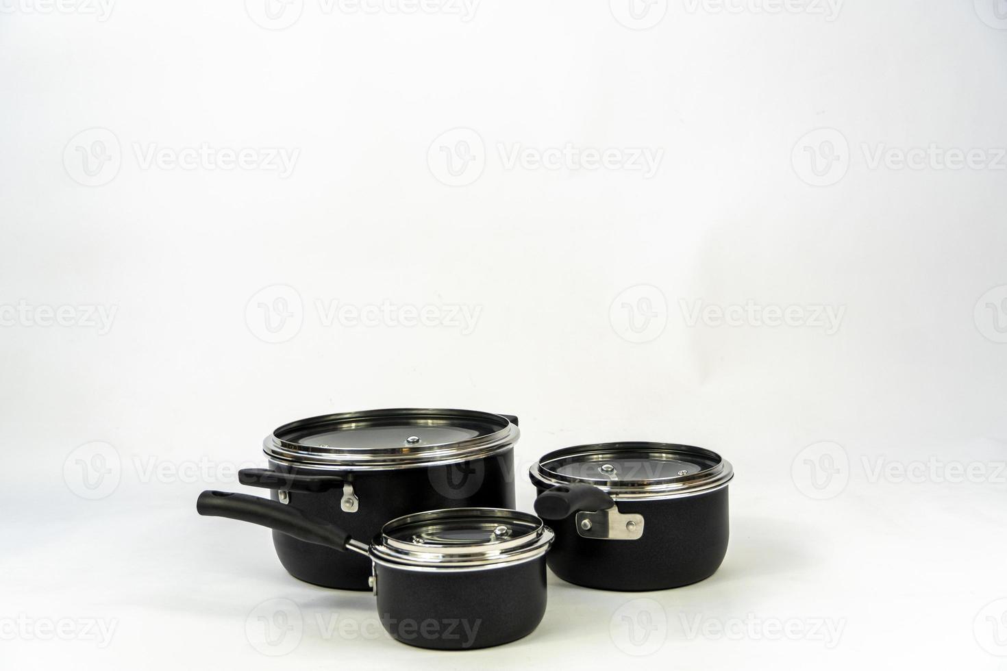 cookware set, steel dinner set isolated on white background, black metal cookware set photo