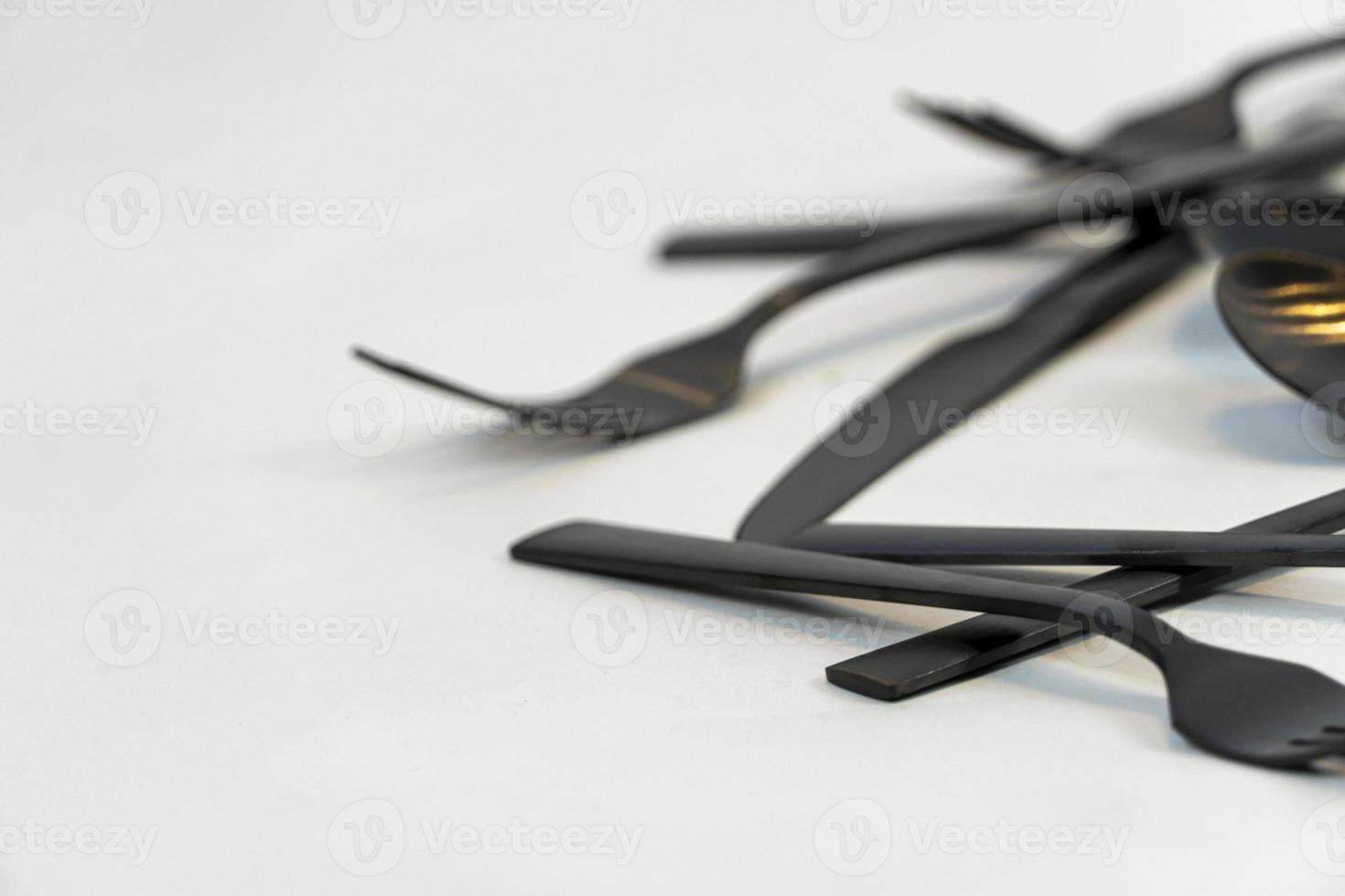 black metal forks and spoons on a white background, mexico photo