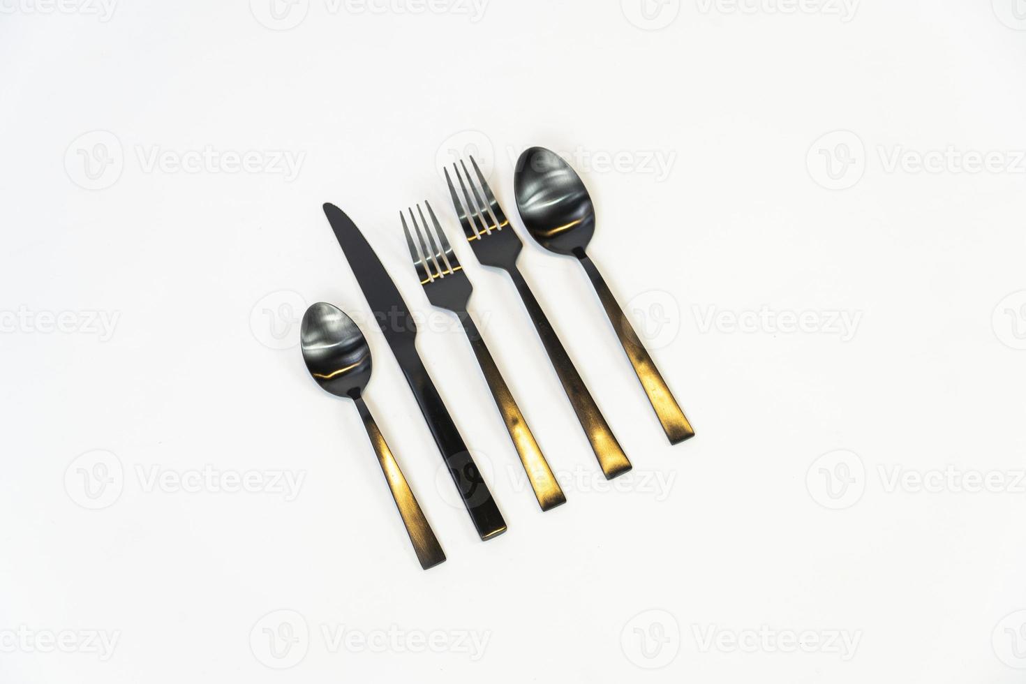 Rack of kitchen utensils, isolated on white. Stainless steel with black handles. mexico photo