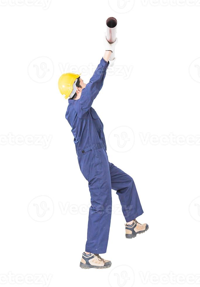 Plumber in uniform holding pvc pipe on white photo