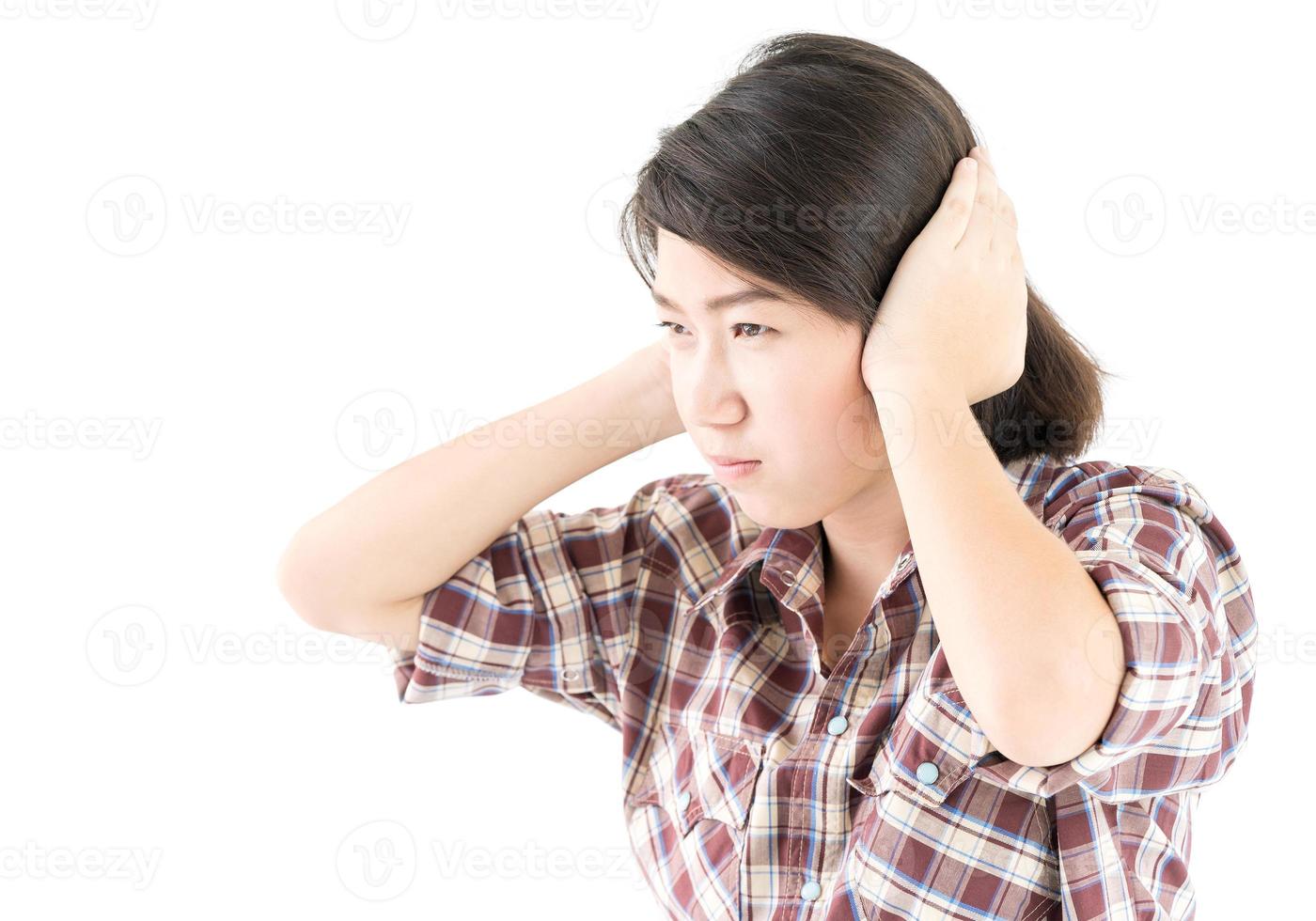 Young woman in a plaid shirt posing in studio on white photo