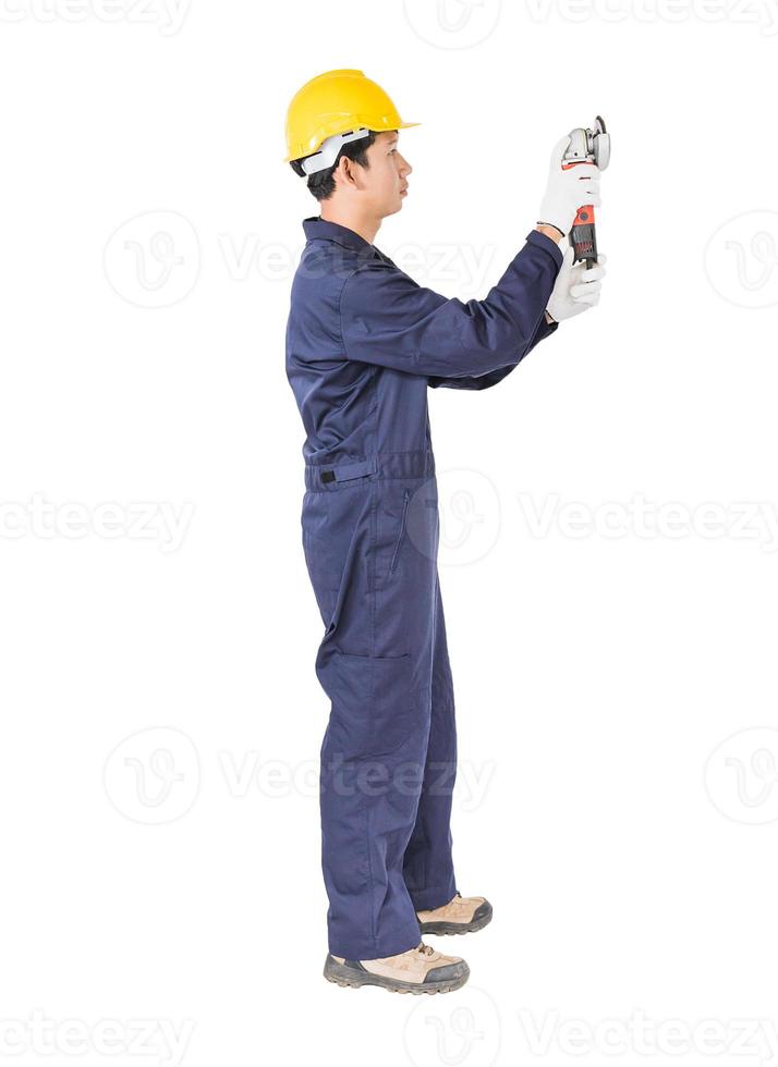 Young handyman in uniform hold grinder photo