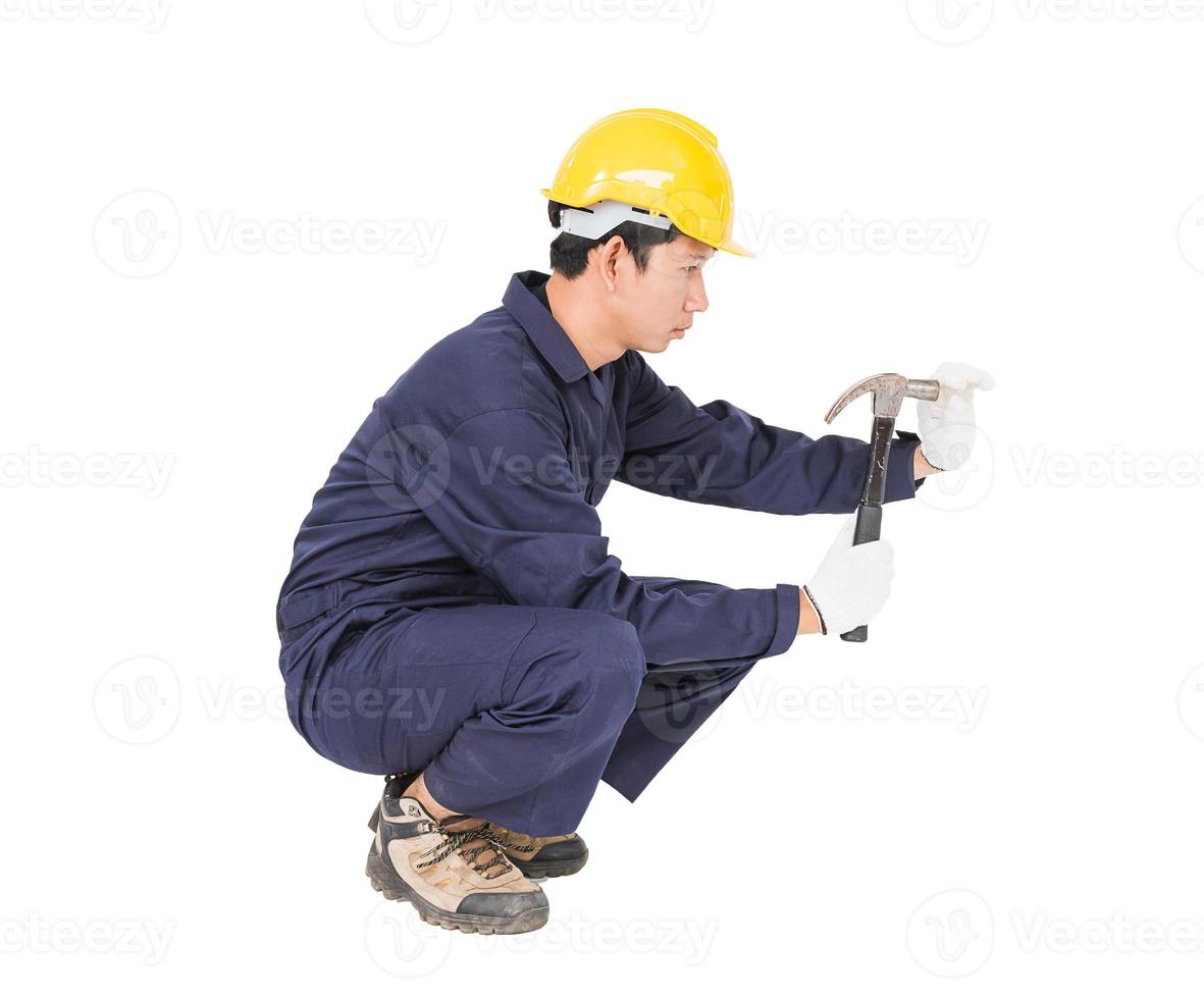 Handyman in uniform with his hammer photo