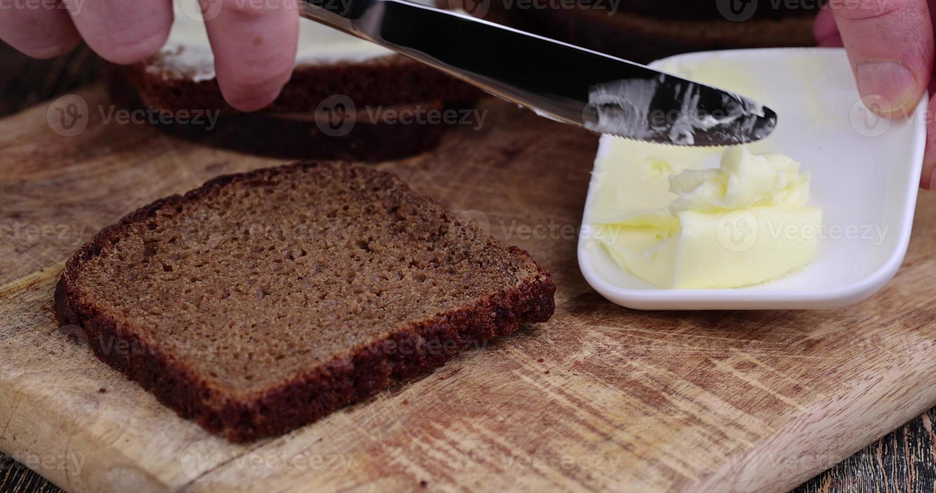 Making sandwiches with rye bread and butter 13628001 Stock Photo at