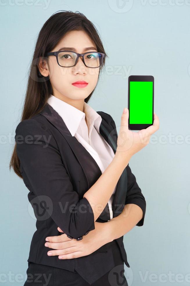 Women holding smartphone mock up green screen photo