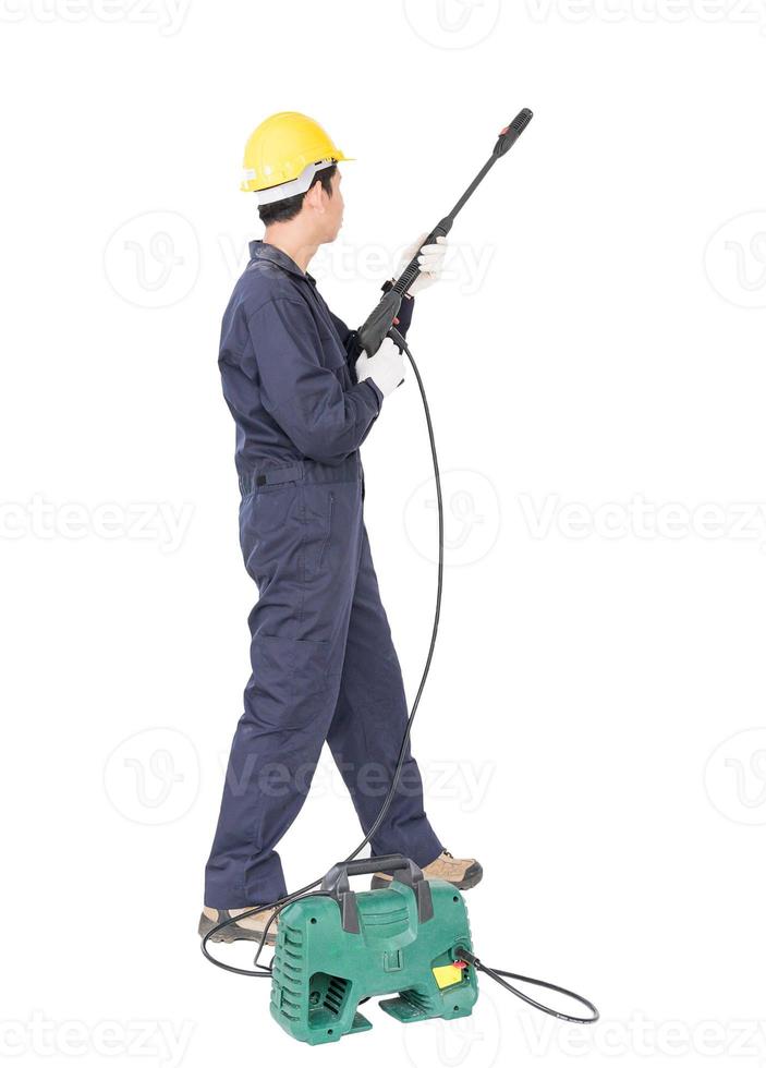 Young man stand and holding high pressure water gun photo