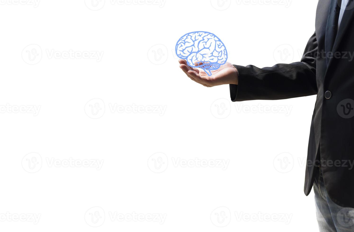 A man holding a brain illustration against a white wall background Concept of mental health protection and care. photo