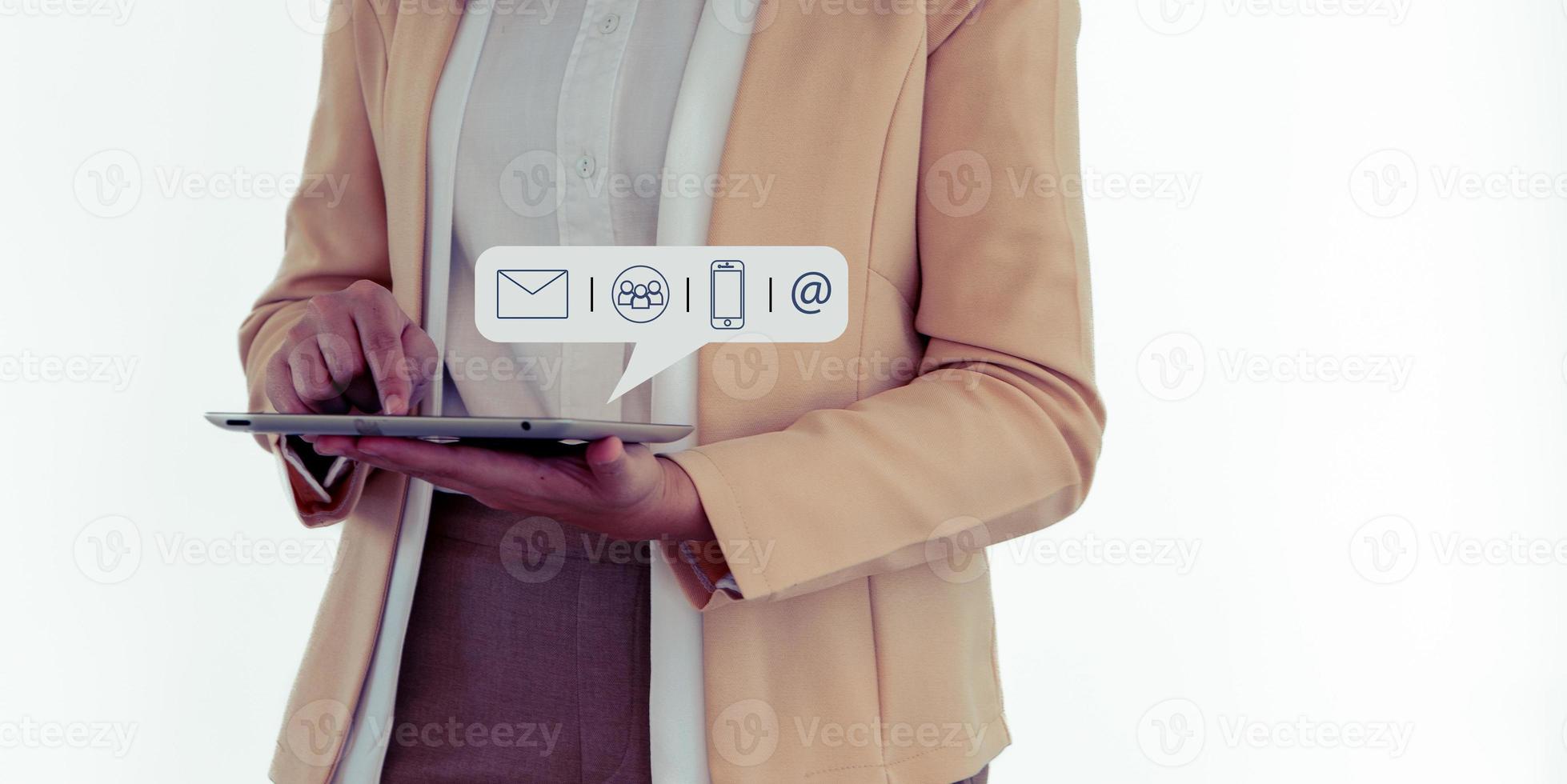 Hands of business woman typing on tablet computer with communication contact icon, E-mail, Phone number, Social media group. photo