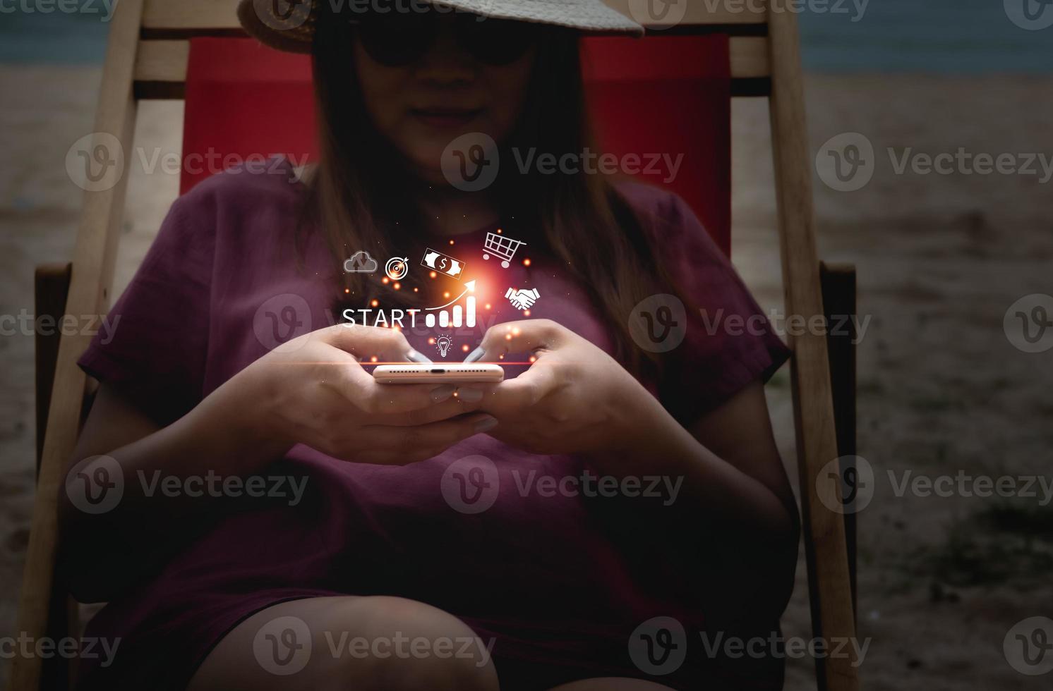 Startup business with icon business and network connection on modern virtual interface from digital smartphone. Young woman touching on mobile phone screen. photo