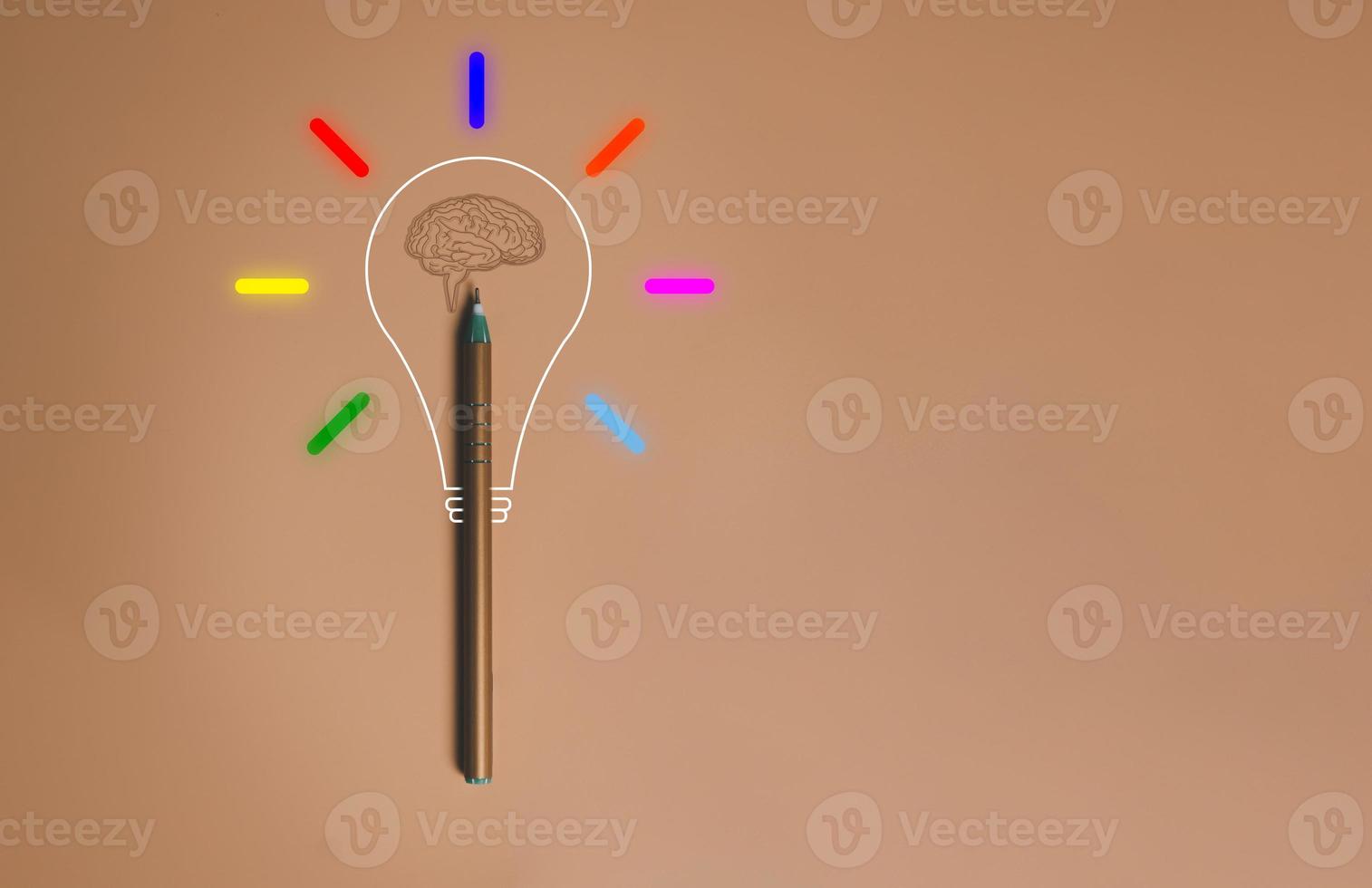 Creative thinking idea from Pen , Brain and light bulb glowing, sign of innovation, solution, education concept with copy space. photo