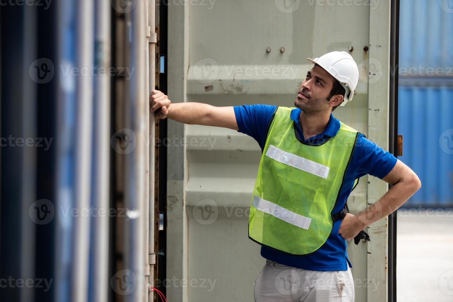 Young logistic worker man wearing worker uniform found out making mistakes at work. photo