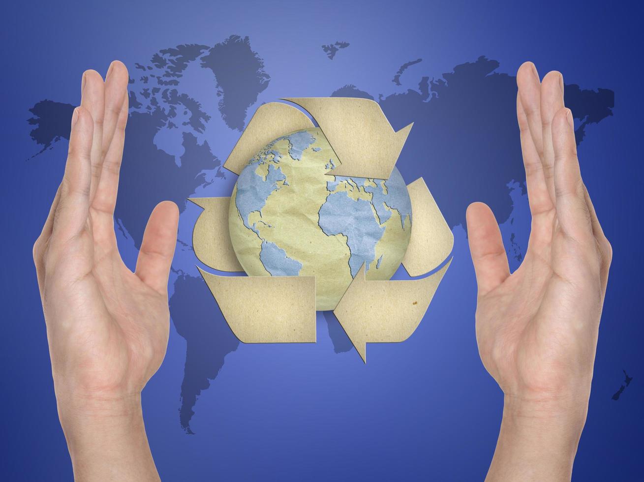 Paper recycling symbol on hand photo