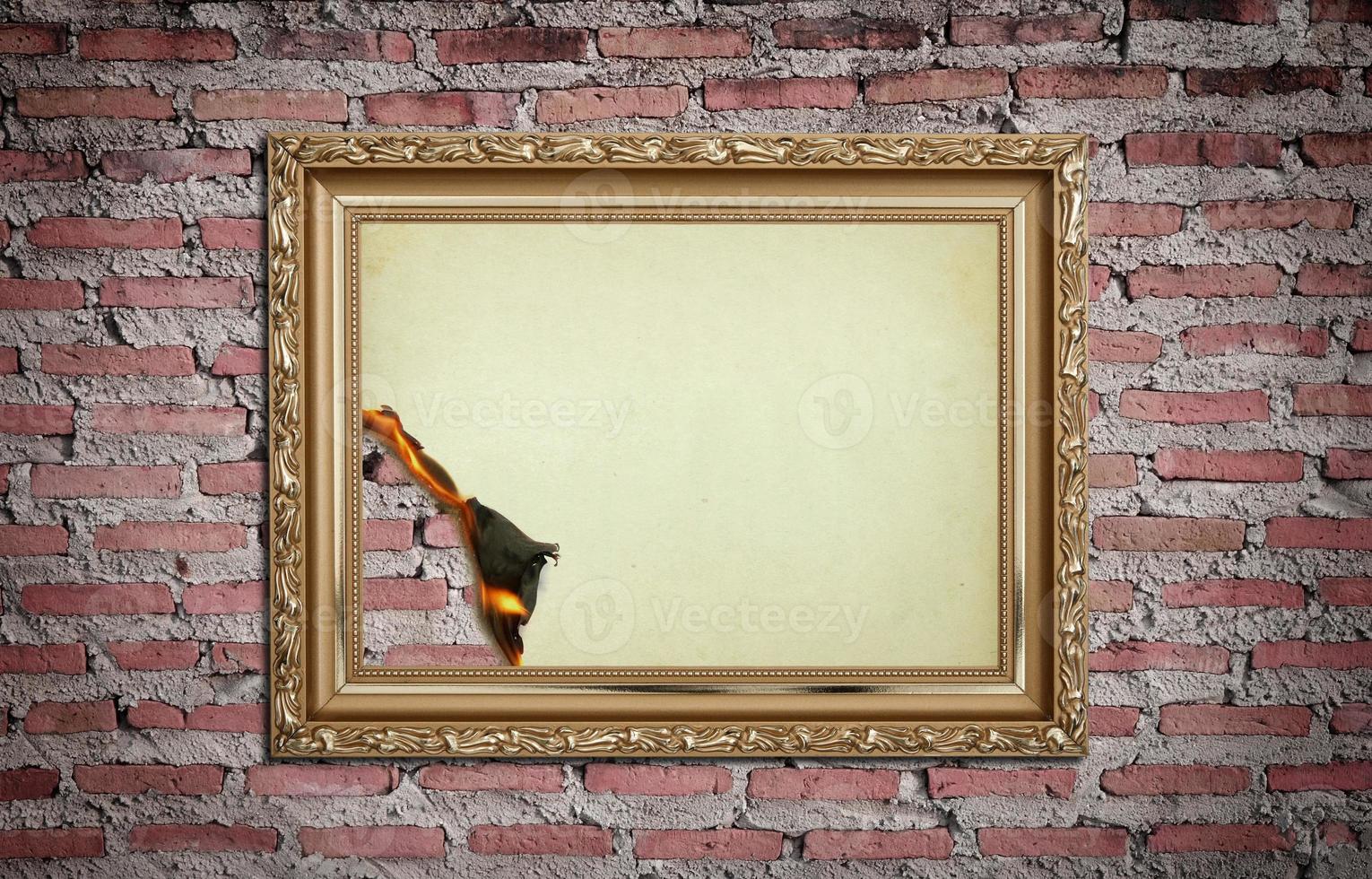 vintage gold frame with burned on wall  background photo