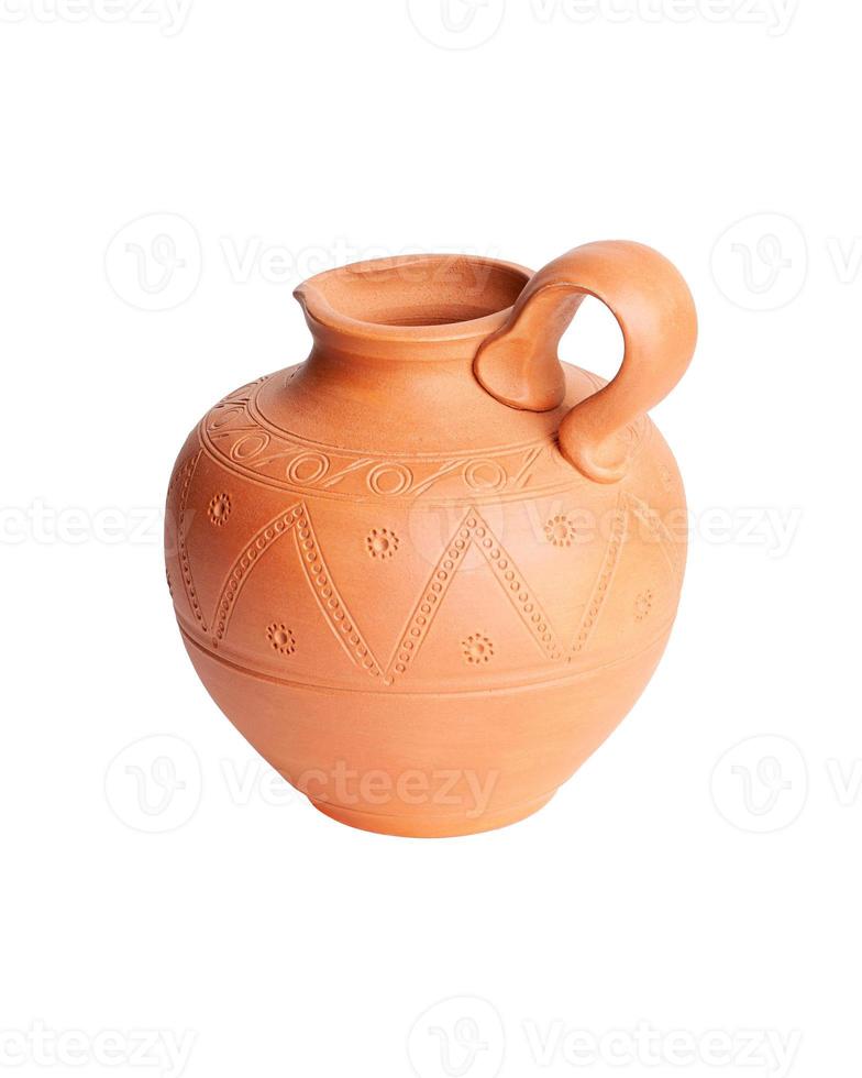 A brown clay jug isolated on a white background photo