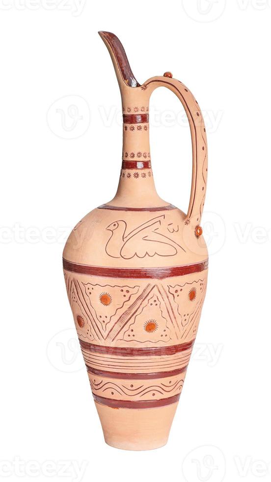 A vintage decorated ceramic jug isolated on a white background photo