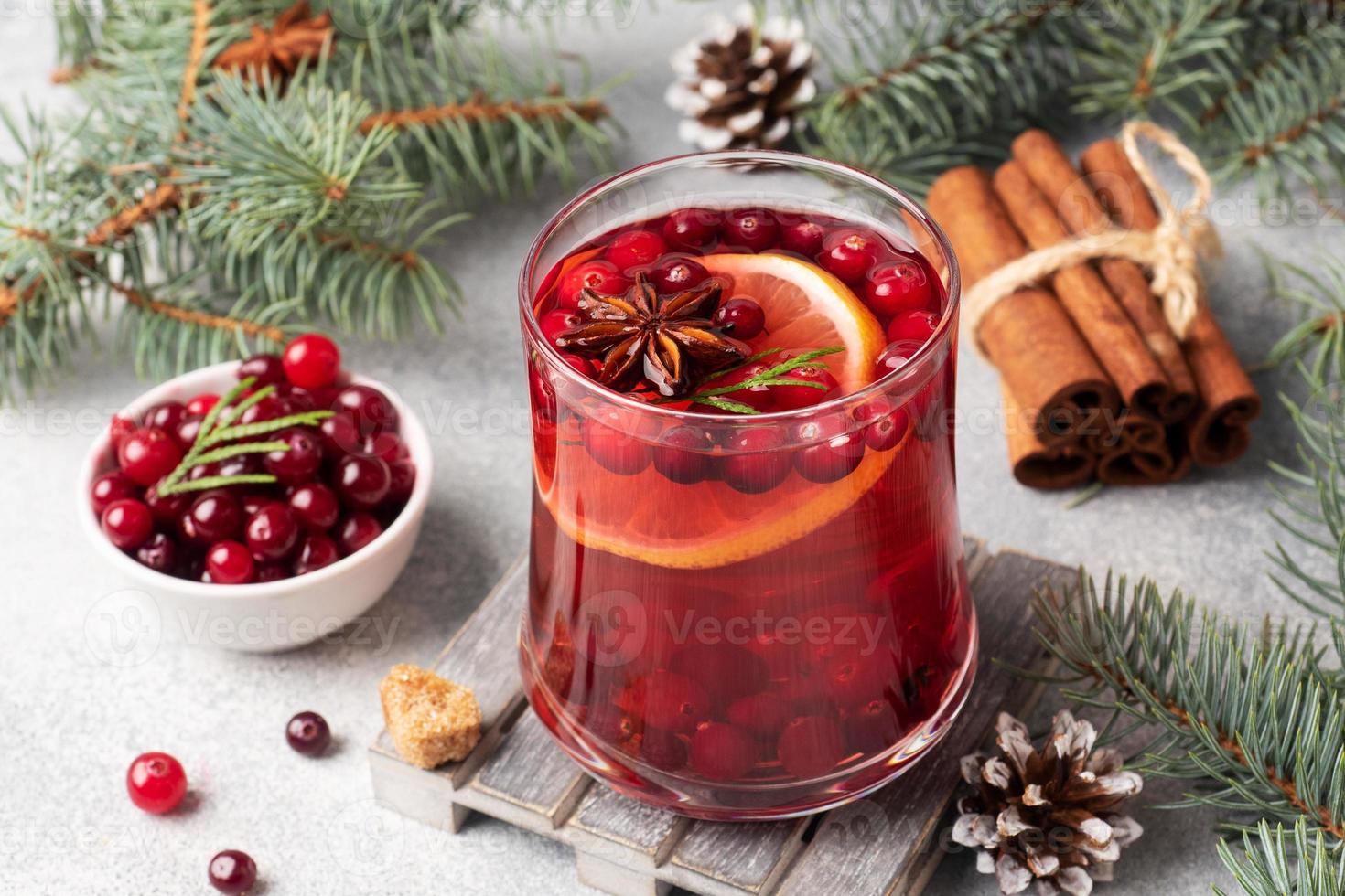 Cranberry juice with lemon and cane sugar. Winter hot drink. photo