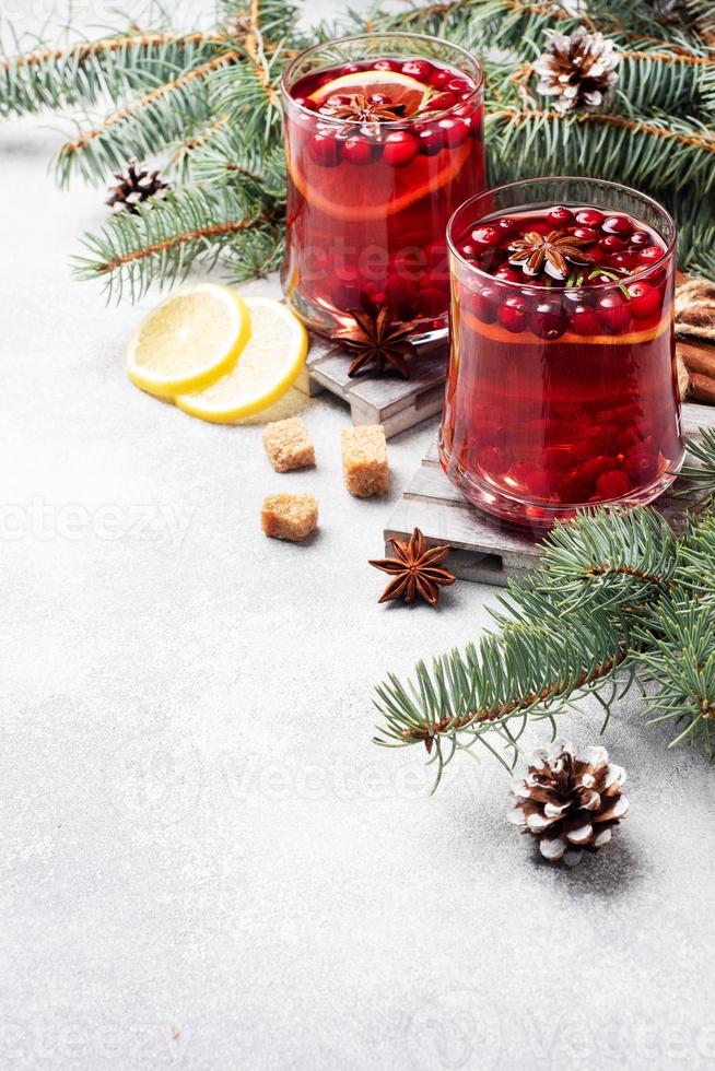 Cranberry juice with lemon and cane sugar. Winter hot drink. Copy space photo