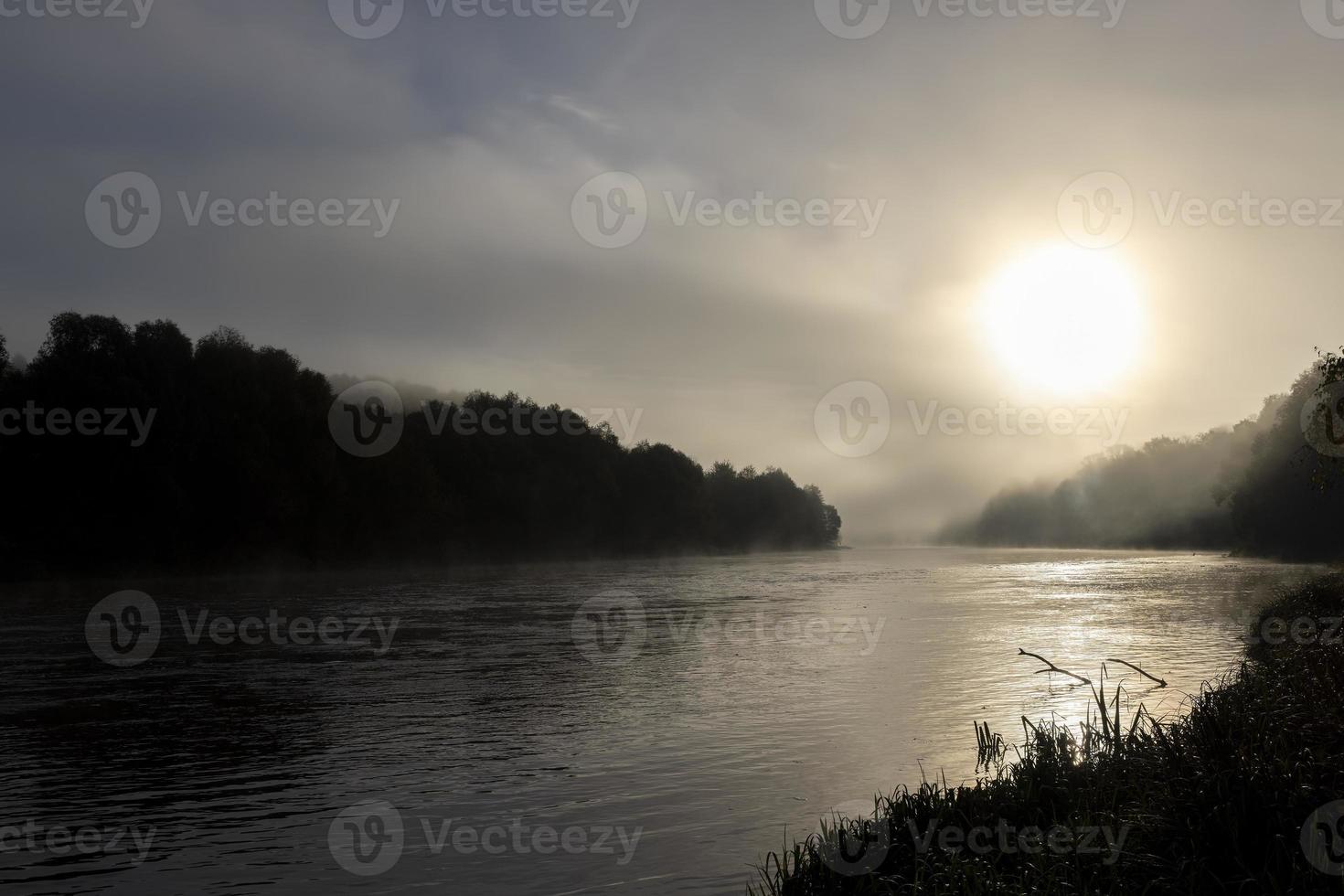 Small fog on the river in autumn photo