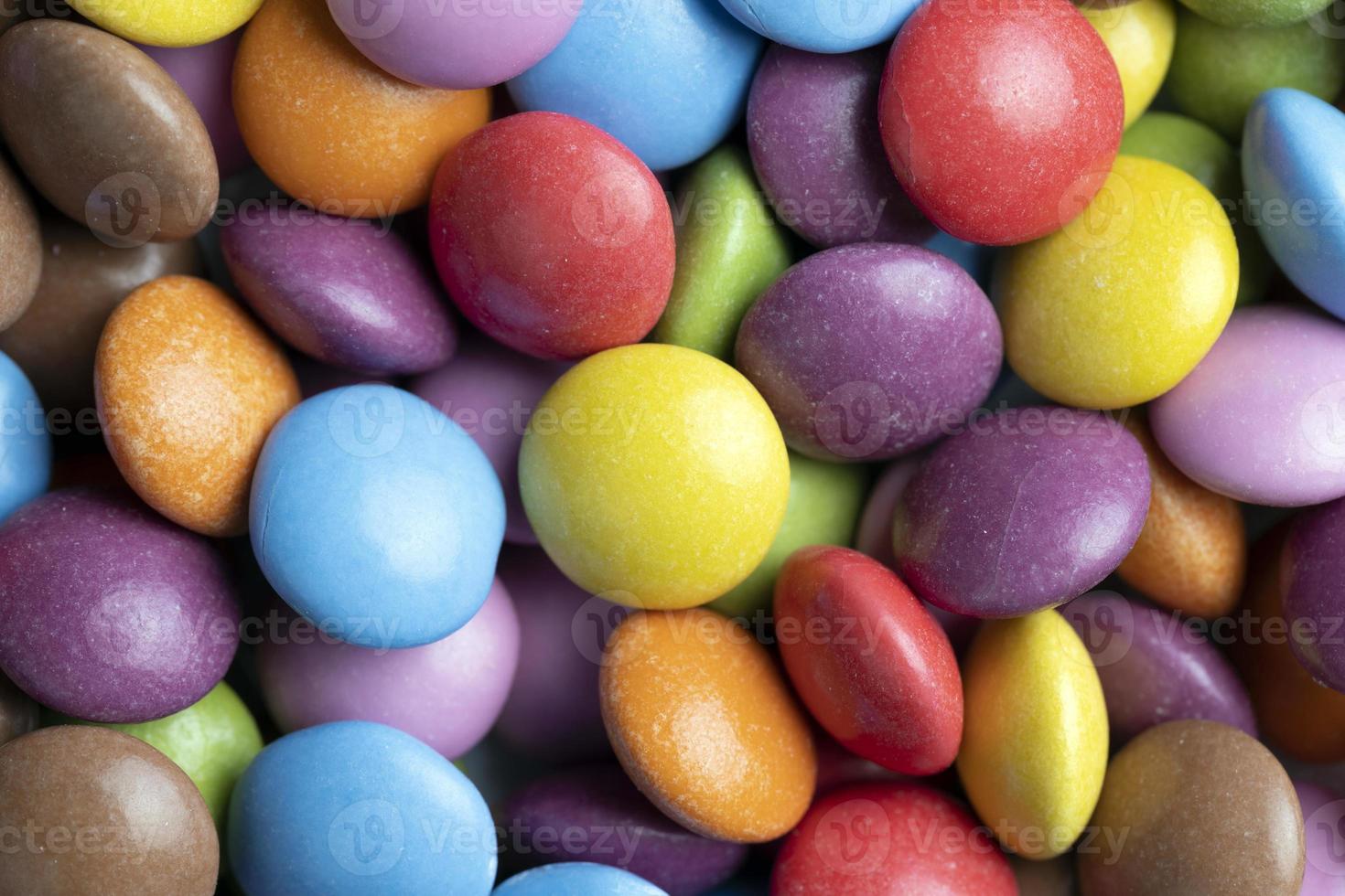 Multicolored chocolates with chocolate filling photo