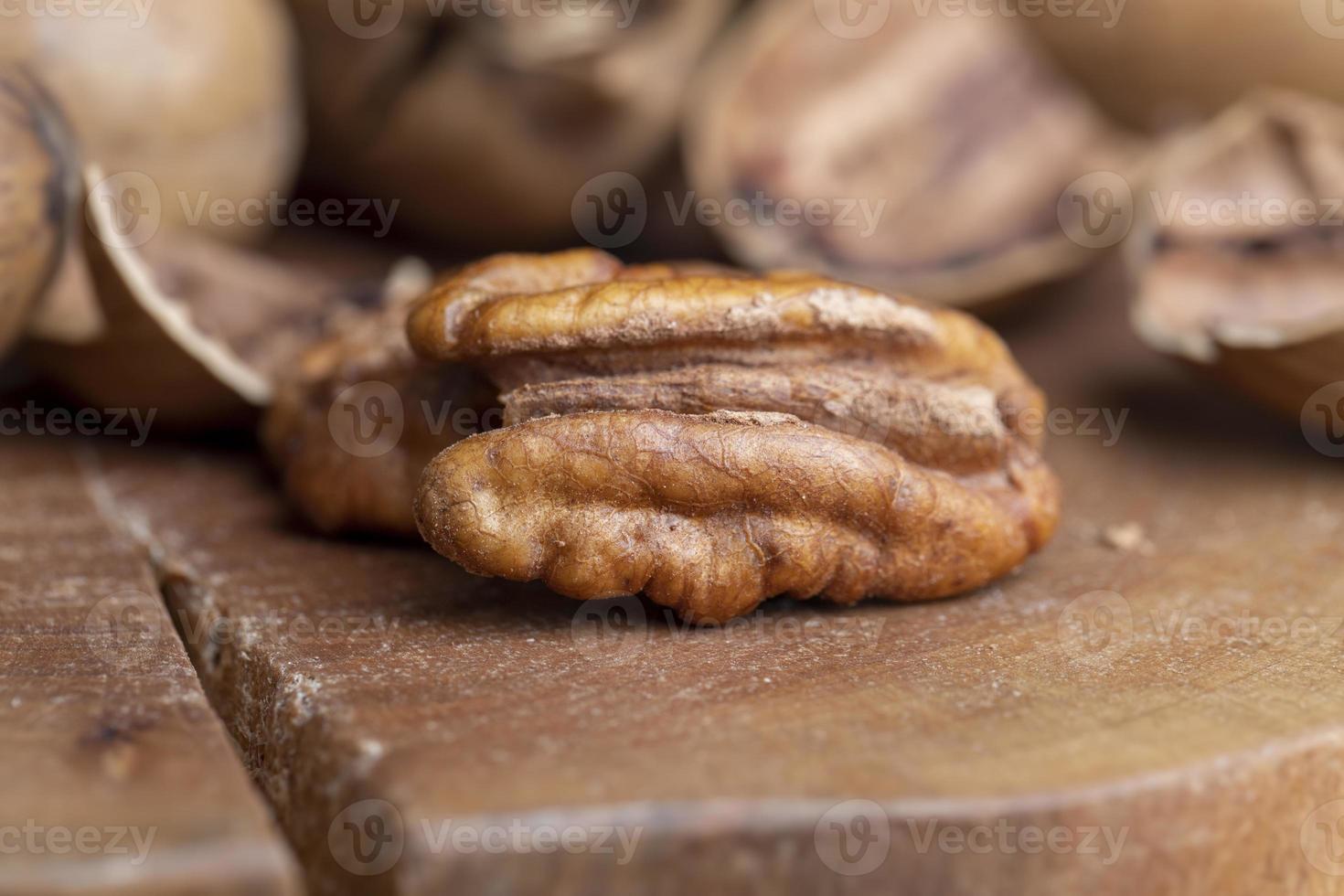Pecan in a shell on the table photo