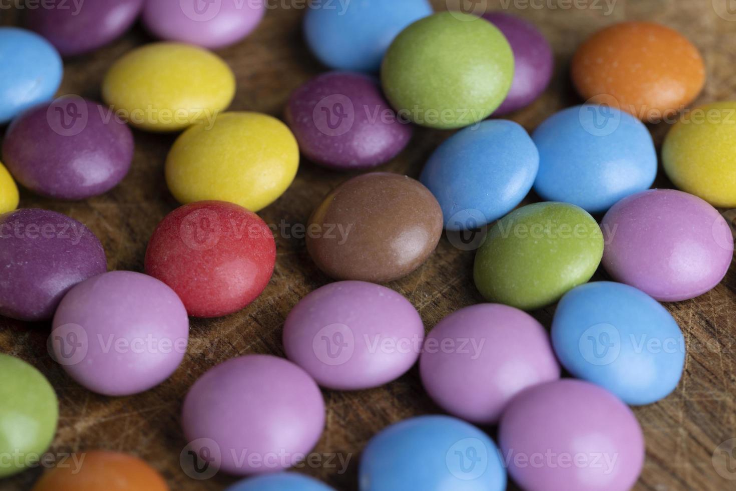 Multicolored chocolates with chocolate filling photo