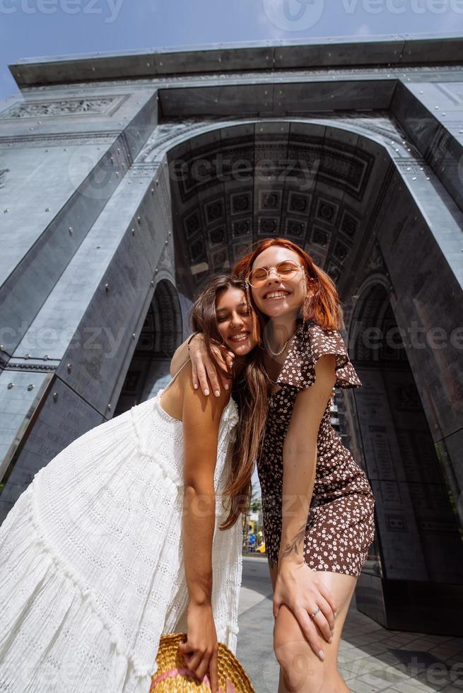 Sexy carefree women posing on street background. photo