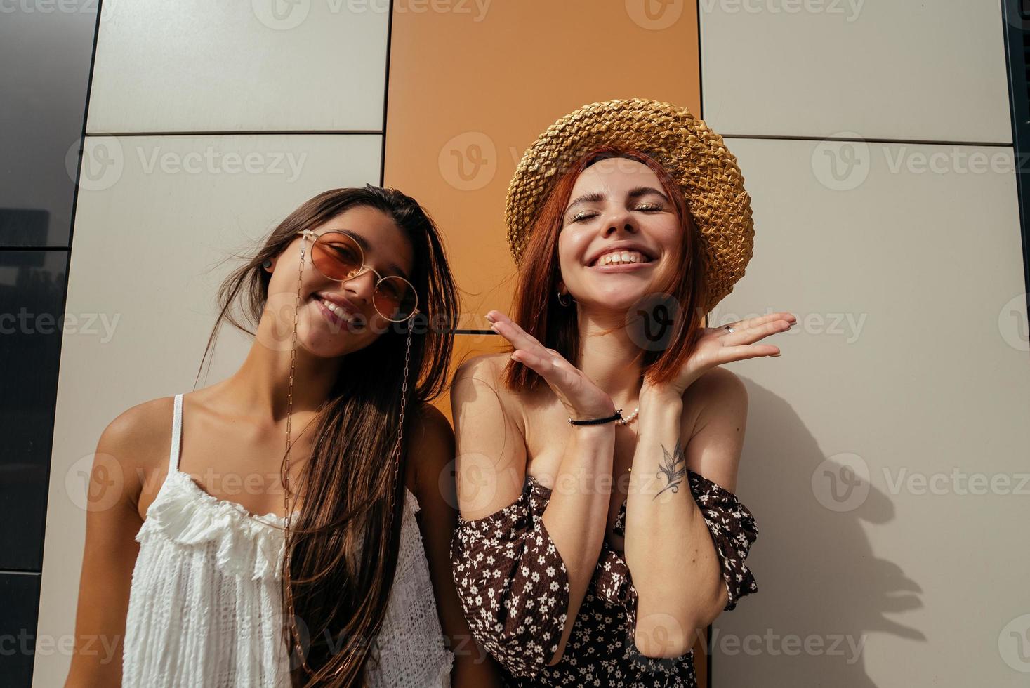 Two attractive young women fooling around in fresh air. photo