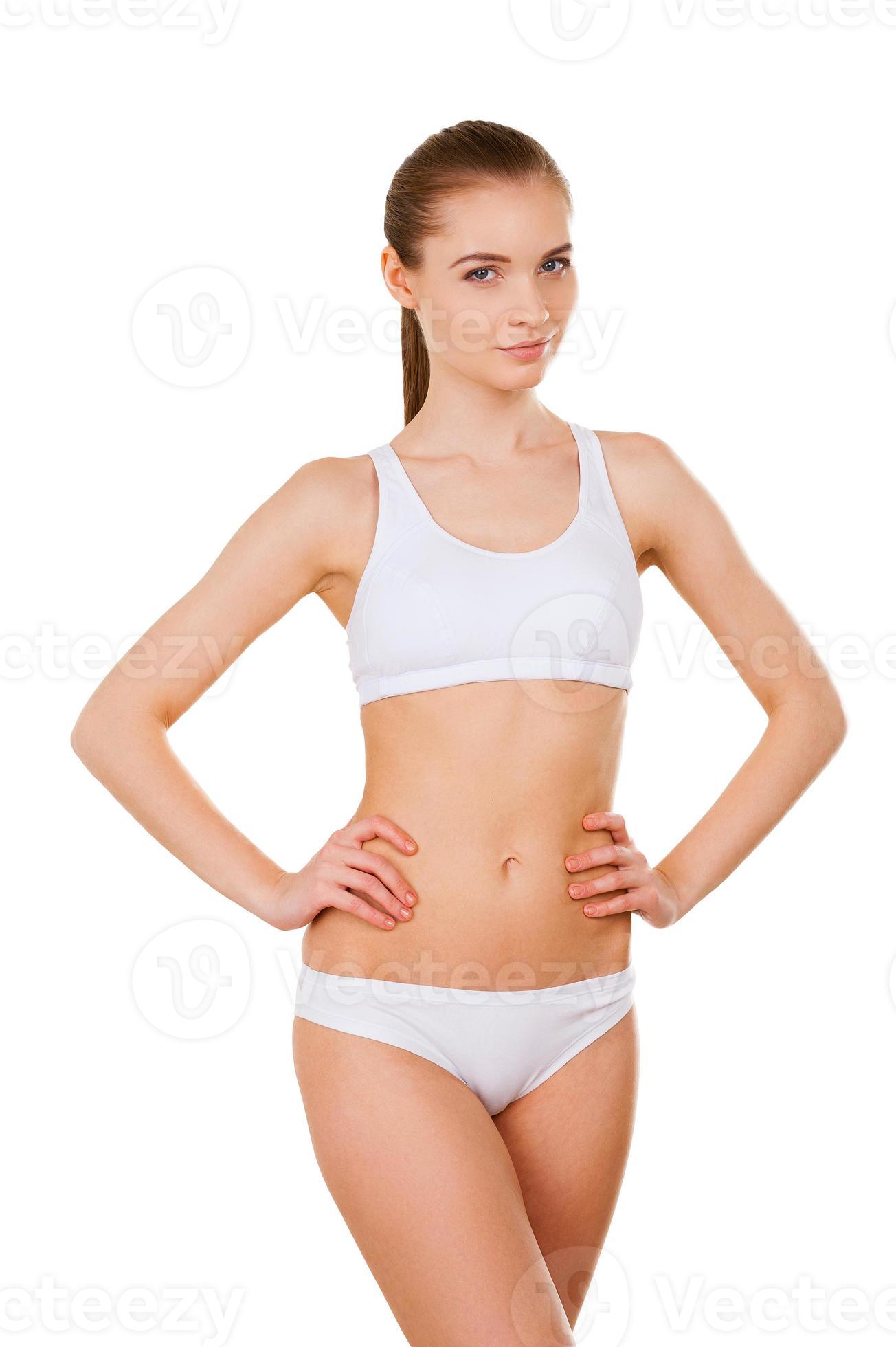 Premium Photo  Fit beauty. close-up of attractive young woman in white bra  and panties holding hands on hip while standing isolated on white