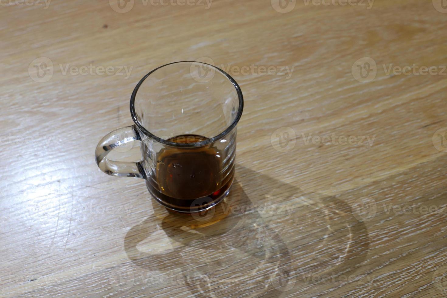 A non-alcoholic soft drink is poured into a glass. photo